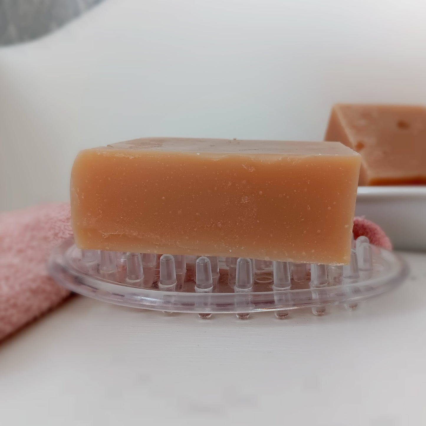Bar of soap on a clear soap dish