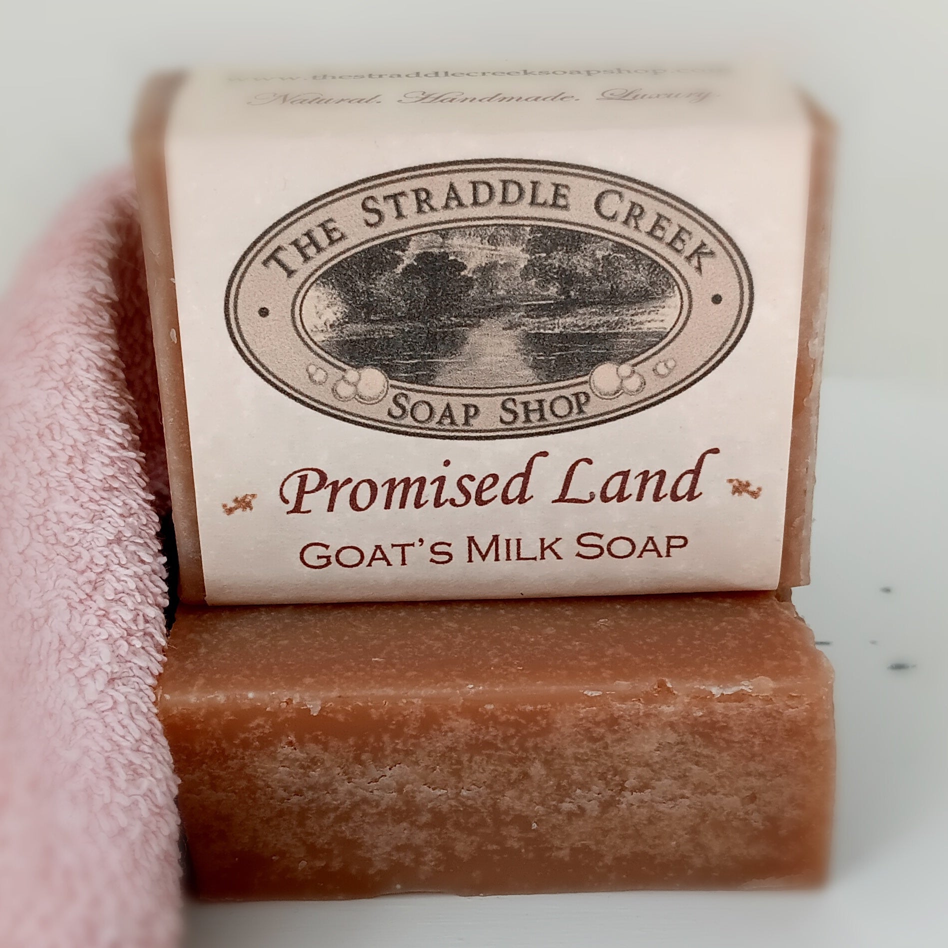 Bar of soap with 'The Straddle Creek Soap Shop' label on a white background