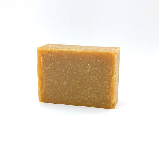front view of promised land unscented goat's milk soap with honey
